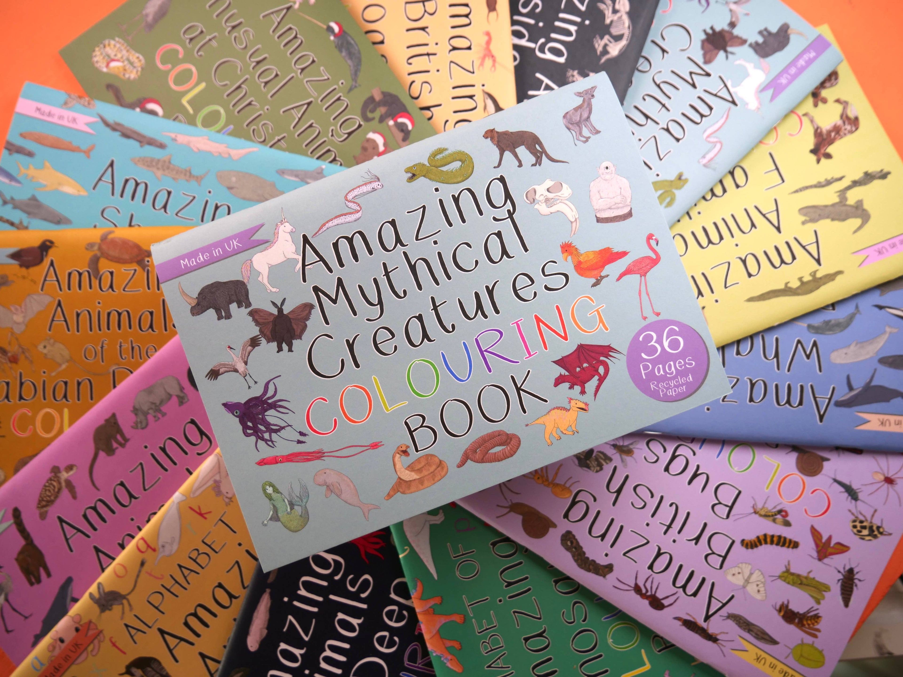 Collection of 'Amazing' themed colouring books on a colorful background