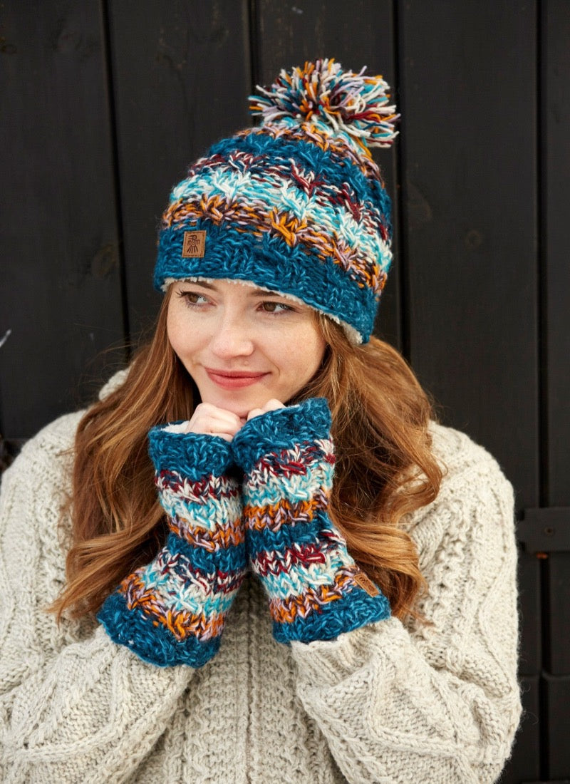 Utrecht bobble beanie in a blue brown, red & white mix.