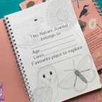 Nature journal with illustrations of a frog, owl, and butterfly on a pink background.