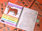 Open book about Amur Tiger with illustrations and text on an orange background with animal patterns.