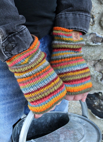 Grassington hand warmers in earthy stripe tones. 