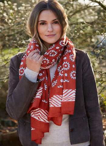 Coggs rust cotton scarf / sarong handprinted with an all over floral pattern.