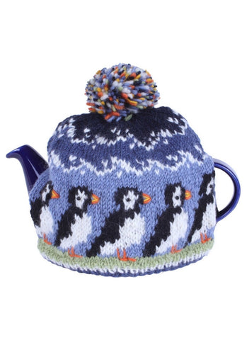 Puffin design tea cosy in shades of blue with white and green