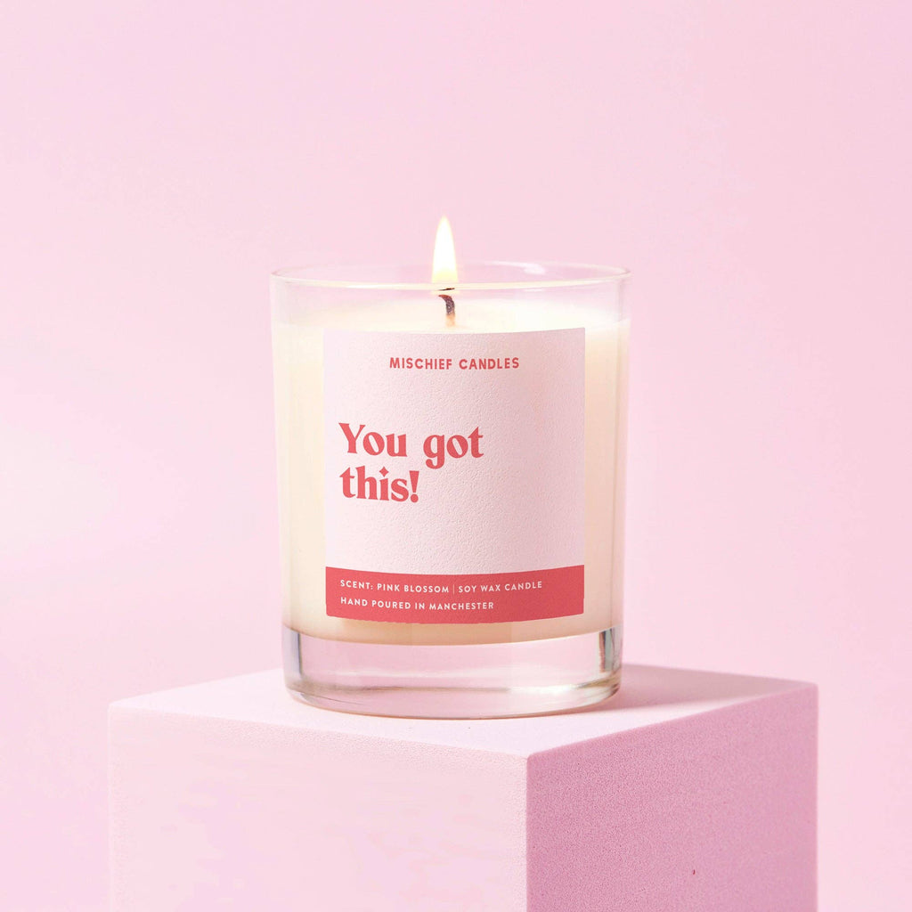 Candle with you git this label' in clear glass jar