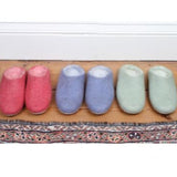 3 pairs of felted slippers in pink blue and mint green colour.