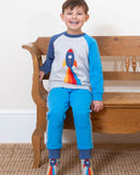 Grey jumper with a rocket on the front, sleeves are two different blues.