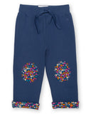 Blue ditsy joggers with flower patches in the knees