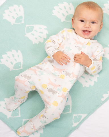 Sleepsuit with little animals printed all over in muted colours.